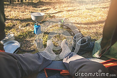 Outdoor tourism - hiker feet with wool socks out of the tent Stock Photo