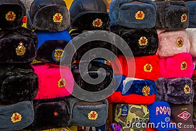 Outdoor view of assorted Russian winter hats made from rabbit fur, located in a store in the streets of Moscow Editorial Stock Photo