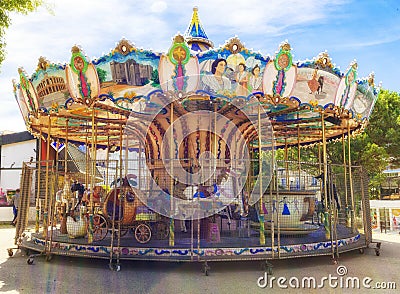 Outdoor vintage flying horse carousel in the the city. Stock Photo