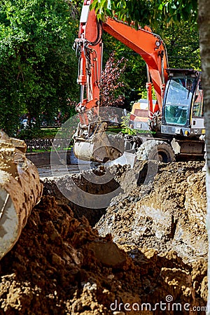 Outdoor work : Excavator digging to moving the soil in construction excavation work Editorial Stock Photo