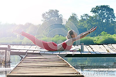 Outdoor yoga. Morning training on a fresh air. Stock Photo