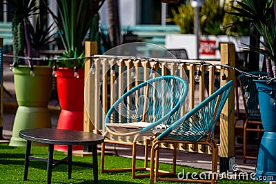 Outdoors photo patio furniture tables and wire chairs modern deco design Stock Photo