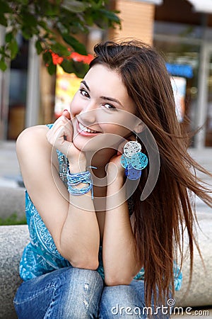 Outdoors street portrait of beautiful young brunette girl Stock Photo
