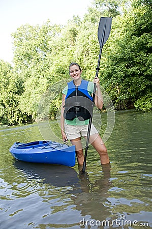 Outdoorsy female with a kayak Stock Photo