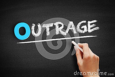 Outrage text on blackboard Stock Photo