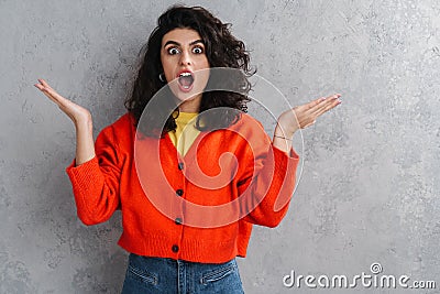 Outraged beautiful brunette girl exclaiming and gesturing at camera Stock Photo