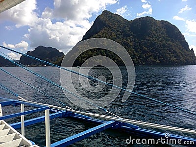 Outriggers of a dive boat during morning diving in Bacuit Bay, El Nido, Palawan, Philippines. Stock Photo
