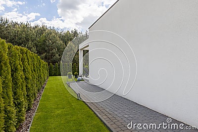 Outside view of suburban house with big window green lawn Stock Photo