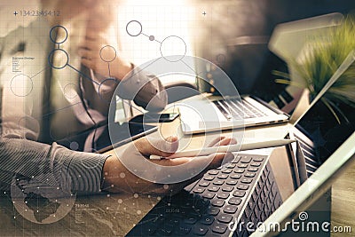 Outsource Developer working on marble Desk Working Laptop Computer Mobile Application Software and digital tablet dock smart Stock Photo
