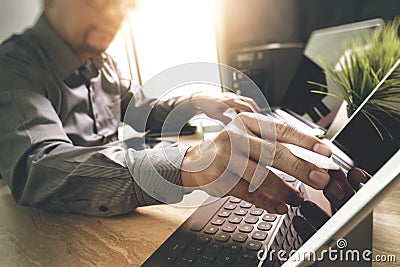 Outsource Developer working on marble Desk Working Laptop Computer Mobile Application Software and digital tablet dock smart Stock Photo