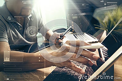 Outsource Developer working on marble Desk Working Laptop Computer Mobile Application Software and digital tablet dock smart Stock Photo