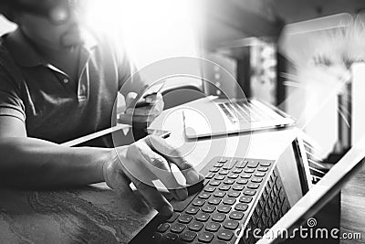 Outsource Developer working on marble Desk Working Laptop Computer Mobile Application Software and digital tablet dock smart Stock Photo