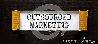 Outsourced marketing symbol. Concept words Outsourced marketing on beautiful white paper. Beautiful black paper background. Stock Photo