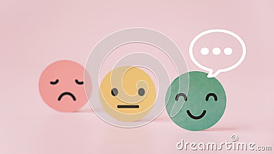 Outstanding smiling face on green paper with speech bubble on pink background, satisfaction survey ,good feedback rating Stock Photo