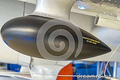 oval shaped airplane navigation antenna attached to airplane wing Editorial Stock Photo