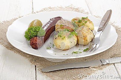 Oven baked potato with hungarian kolbasz Stock Photo