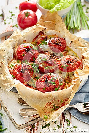 Oven baked tomatoes stuffed with spinach, cheese and herbs Stock Photo