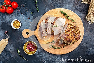 Oven-Barbecued Pork shoulder, Christmas ham of turkey. large piece of baked pork with mustard on a cutting board, banner, menu Stock Photo