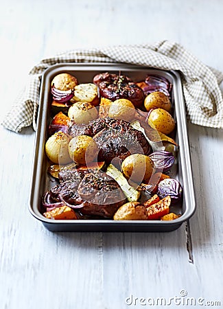 Oven-Roasted Eisbein with Autumn Vegetables Stock Photo