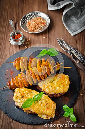 Oven roasted meat under cheese and potato kebab Stock Photo