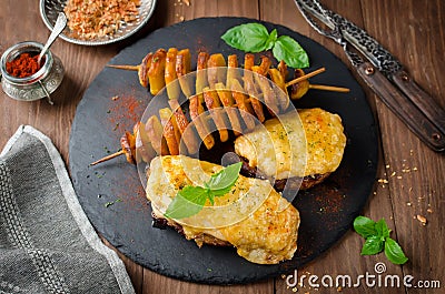 Oven roasted meat under cheese and potato kebab Stock Photo