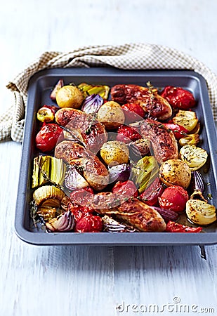 Oven-Roasted Sausages with Autumn Vegetables Stock Photo