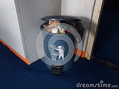 Over-capacity bins trigger the onset of bacteria and diseases for the occupants of the house Stock Photo