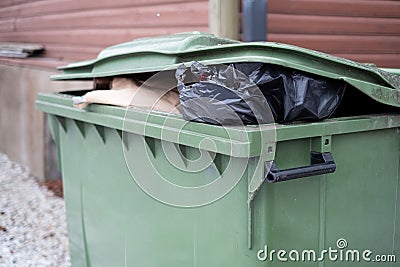 Trash can with lots of rubbish. Waste management Stock Photo