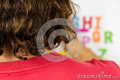 Over the shoulder shot person looking at alphabet magnets Stock Photo