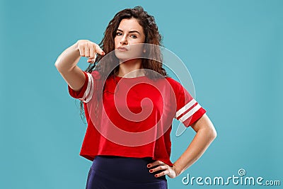 The overbearing business woman point you and want you, half length closeup portrait on blue background. Stock Photo