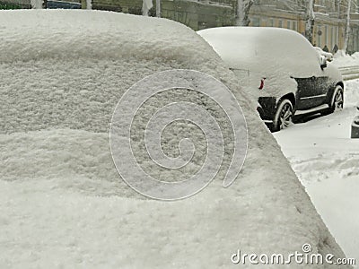 Overcast. Natural disasters winter, blizzard, heavy snow paralyzed city car roads, collapse. Snow covered cyclone Stock Photo