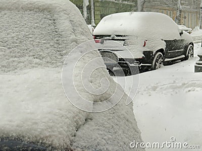 Overcast. Natural disasters winter, blizzard, heavy snow paralyzed city car roads, collapse. Snow covered cyclone Stock Photo