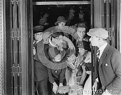 Overcrowded elevator Stock Photo