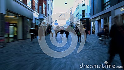 Overcrowded street in city center, people in hurry walking on pedestrian street Stock Photo