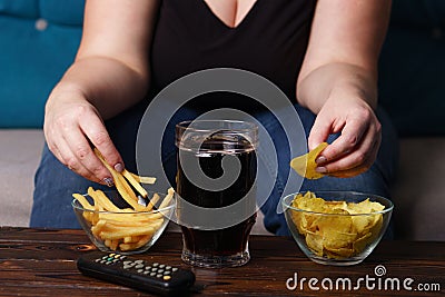 Overeating, sedentary lifestyle, bad habits Stock Photo