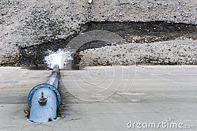 Overflow pipe and spillage on a damn and reservoir Stock Photo