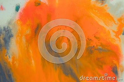 Overflowing bright orange and dark blue paint on paper Stock Photo