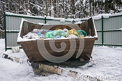 Overflowing metal containers with garbage.scattered debris,pollution of the environment Editorial Stock Photo