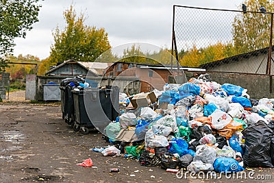 Overflowing trash cans. Damaging the planet`s ecology Editorial Stock Photo
