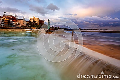 Overflows at Fairy Bower ocean rock pool Stock Photo