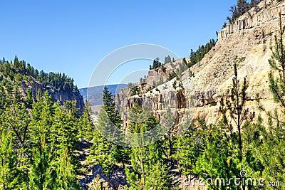 Overhanging Cliff at Tower Fall in Yellowstone National Park Stock Photo