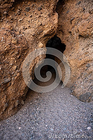Overhanging Walls of Sidewinder Canyon Form An Interesting Slot Canyon Stock Photo