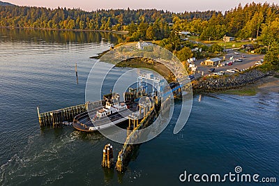 Overhead Aerial View of a Small Ferryboat docking on Lummi Island. Stock Photo