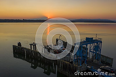 Overhead Aerial View of a Small Ferryboat docking on Lummi Island. Stock Photo