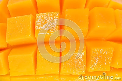 Overhead background texture of colorful orange tropical mango in full frame wide angle view, Mango meat close up, Delicious tropic Stock Photo