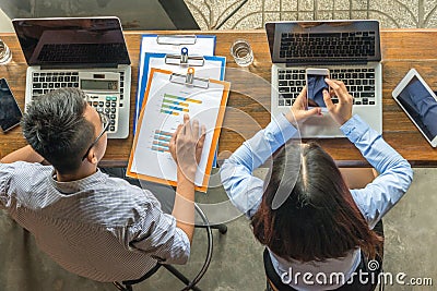 Overhead business angle of Asian employees working Stock Photo