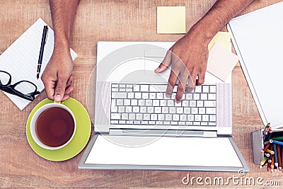 Overhead of businessman typing on laptop Stock Photo