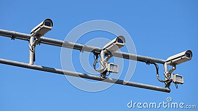 Overhead CCTV traffic cameras on steel pole Stock Photo