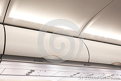 Overhead compartment in commercial aircraft. Stock Photo