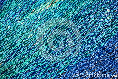 Full frame view of blue/green fishing nets. Stock Photo